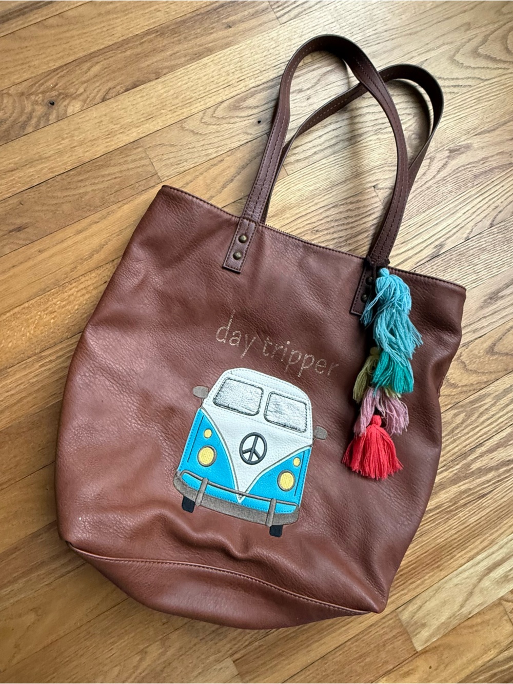 The Sak Brown Leather Tote with Blue Van Patch and Multi-Color Tassels
